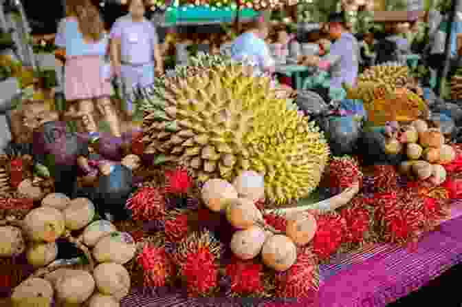 A Lively Durian Festival In Thailand, Featuring Stalls Adorned With Colorful Durians And Enthusiastic Visitors. The Durian Tourist S Guide To Thailand