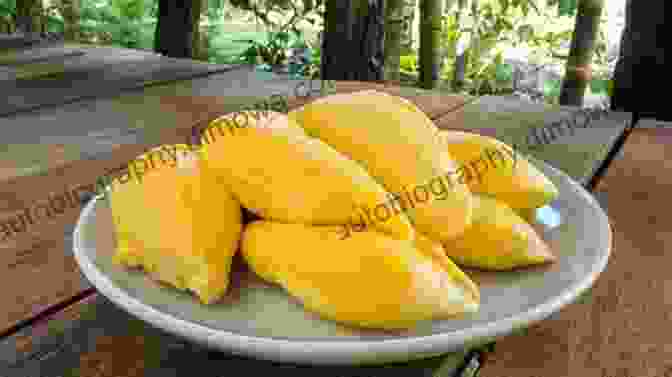 A Smiling Traveler Savoring A Ripe Durian, Relishing Its Creamy, Delectable Taste. The Durian Tourist S Guide To Thailand