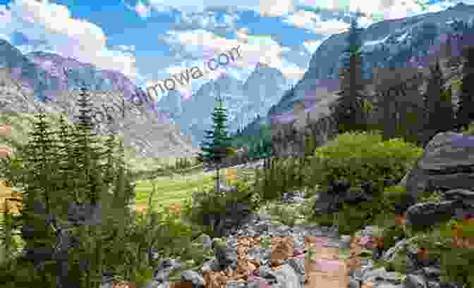 Hikers Traversing A Rugged Mountain Trail, Surrounded By Stunning Alpine Scenery The Canadian Highland Greg Shaffer